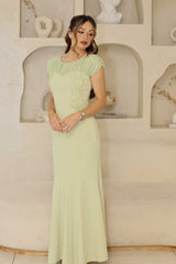 Pistachio fitted dress with pleated chiffon sleeves and beaded bodice.