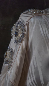 Exclusive Cream Silk satin dress with Beading on neckline and sleeve.