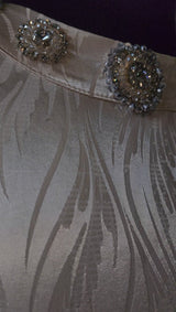 Exclusive Cream Silk satin dress with Beading on neckline and sleeve.