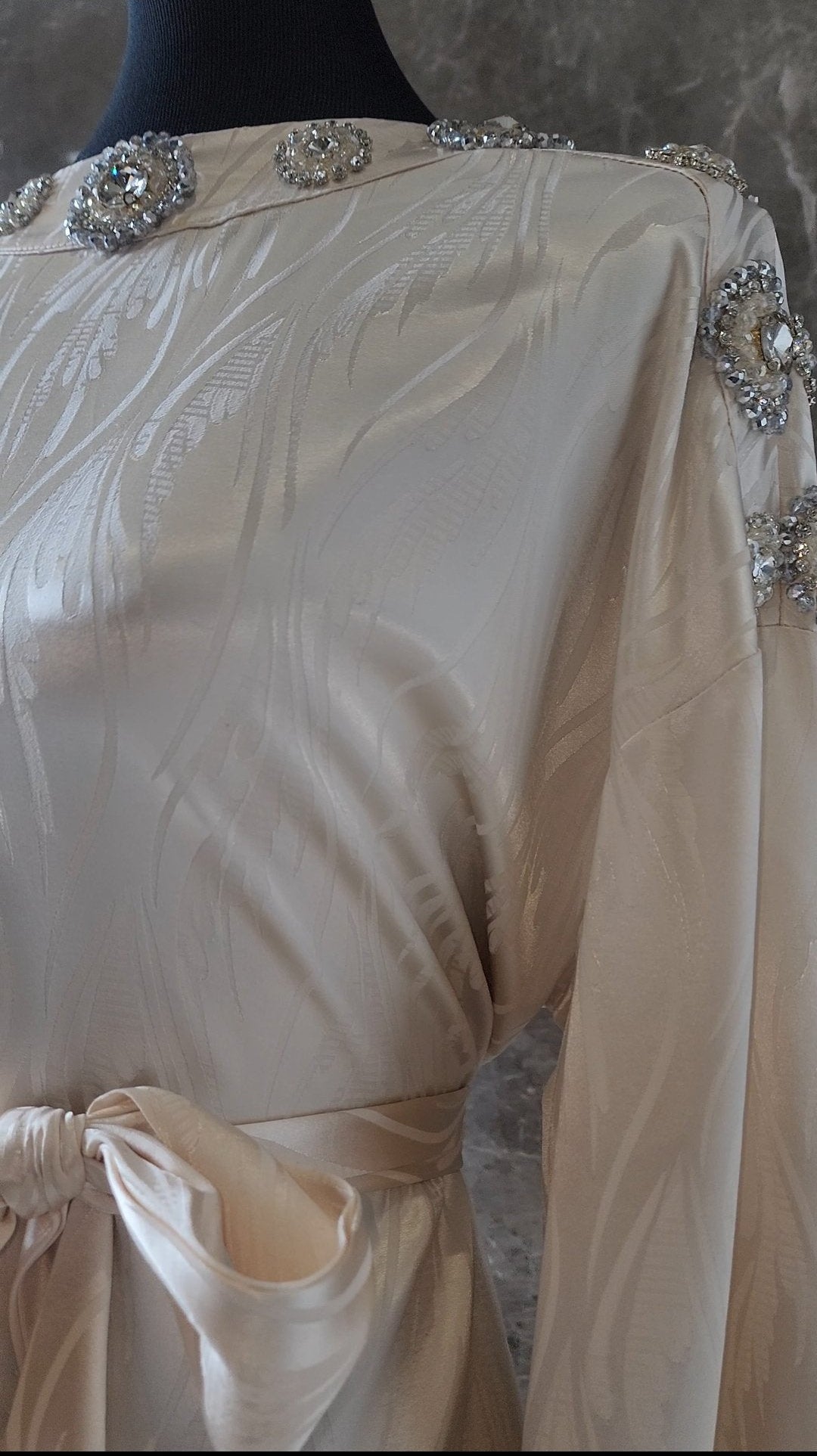 Exclusive Cream Silk satin dress with Beading on neckline and sleeve.