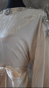 Exclusive Cream Silk satin dress with Beading on neckline and sleeve.