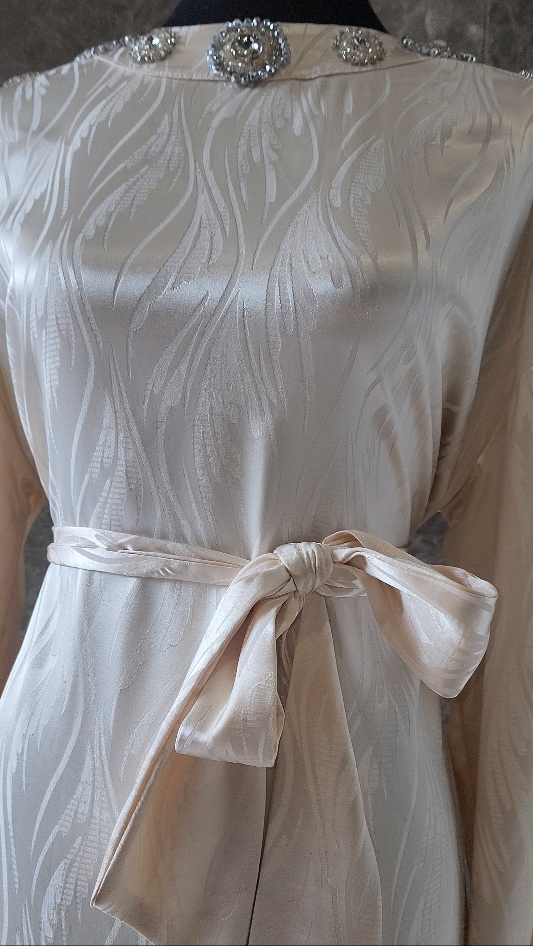 Exclusive Cream Silk satin dress with Beading on neckline and sleeve.