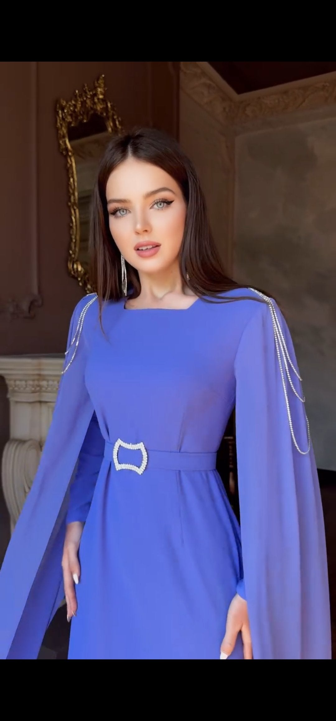 Exclusive Periwinkle Cape Sleeve Design Dress with jeweled belt and jeweled shoulder detail.