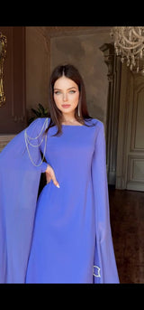 Exclusive Periwinkle Cape Sleeve Design Dress with jeweled belt and jeweled shoulder detail.