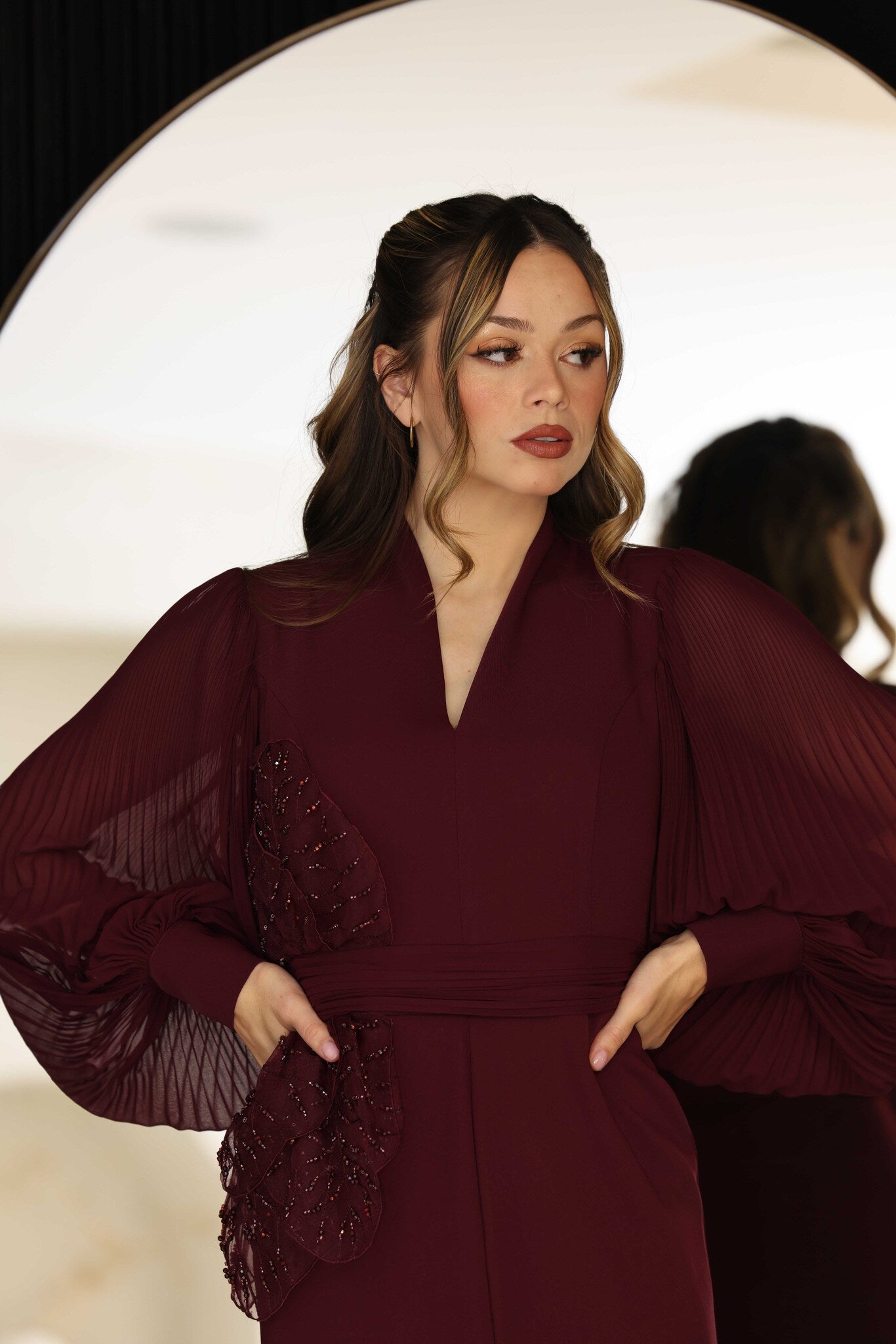Burgundy dress with 3D floral hand-beaded appliqué on the bodice and sleeves.