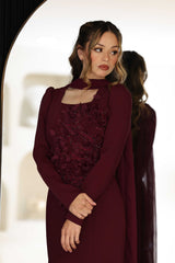Burgundy dress with floral hand-beaded appliqué detailing.