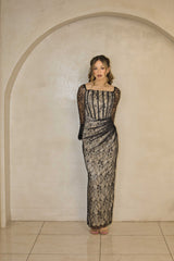 Black and nude lace maxi dress with full-length lace detailing.