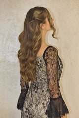 Black and nude lace maxi dress with full-length lace detailing.