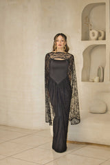 Lace evening dress with fitted corset bodice and cape sleeves.