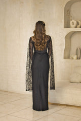Lace evening dress with fitted corset bodice and cape sleeves.