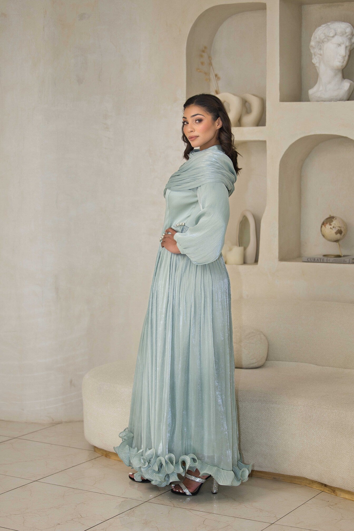 Mint green chiffon pleated dress with rhinestone detailing.