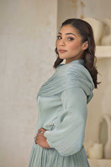 Mint green chiffon pleated dress with rhinestone detailing.