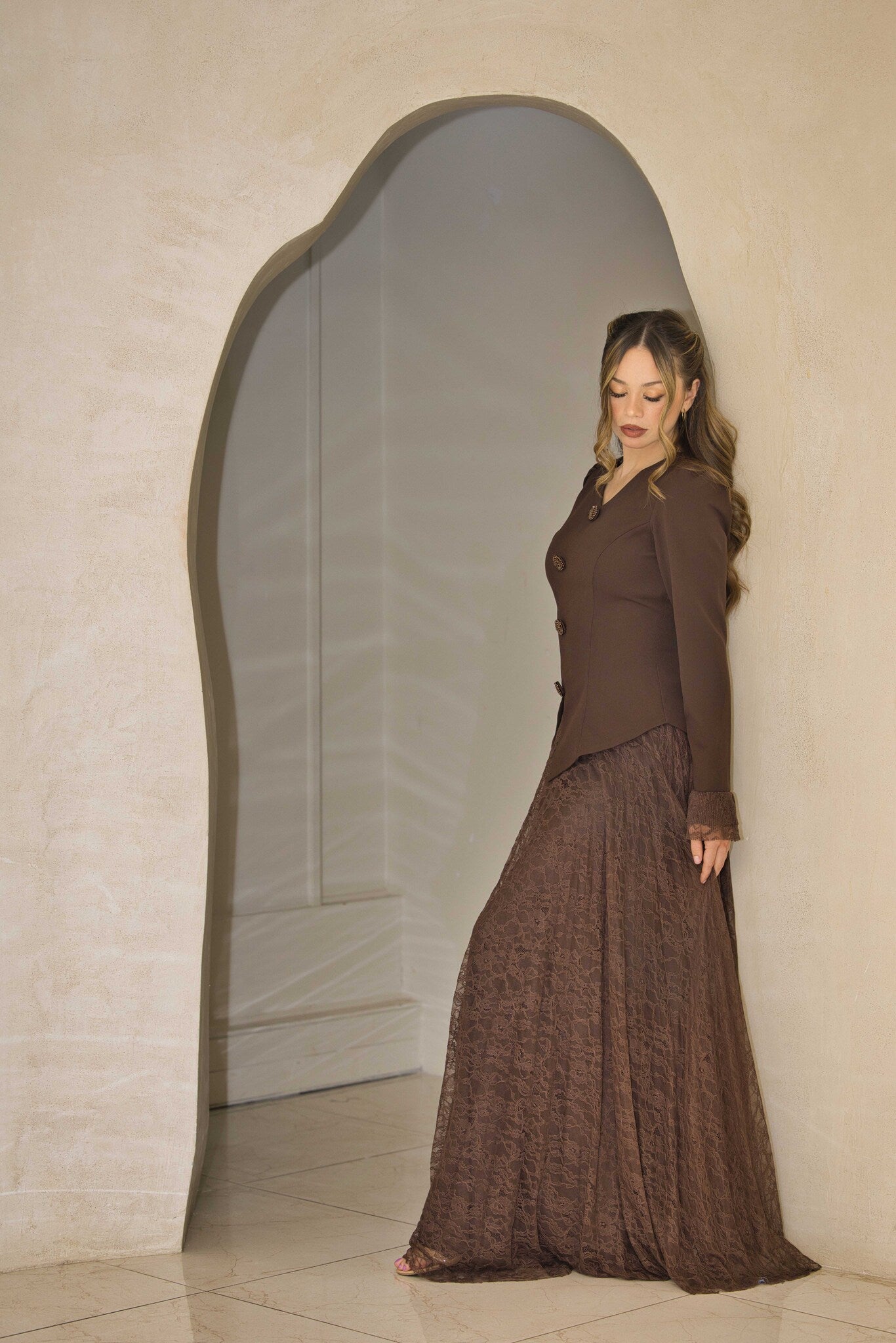 Chocolate brown lace dress with crystal button detail.