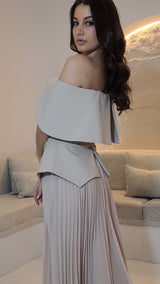 Exclusive Nude Peplum Dress with Crystal Detail.