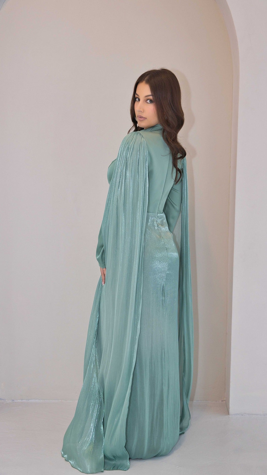 Exclusive Liquid Chiffon Cape Sleeve dress with Jewel detail on waistline