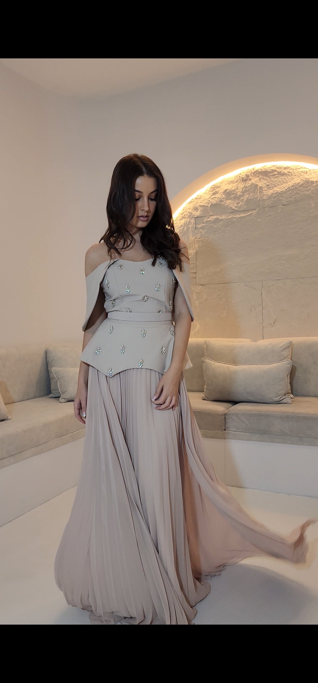 Exclusive Nude Peplum Dress with Crystal Detail.