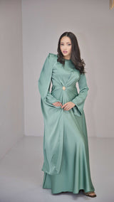 Sage Green Silk Satin Dress with Gold Embellishment and a Single Sided Cape Sleeve.