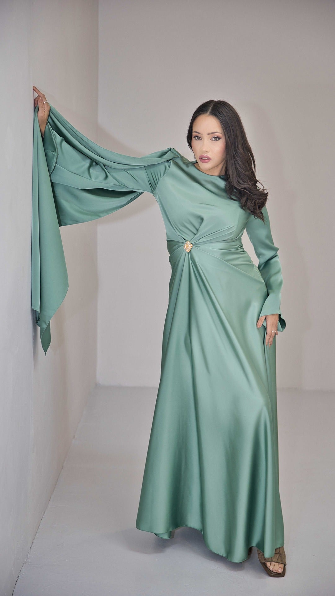 Sage Green Silk Satin Dress with Gold Embellishment and a Single Sided Cape Sleeve.