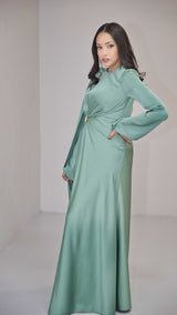 Sage Green Silk Satin Dress with Gold Embellishment and a Single Sided Cape Sleeve.