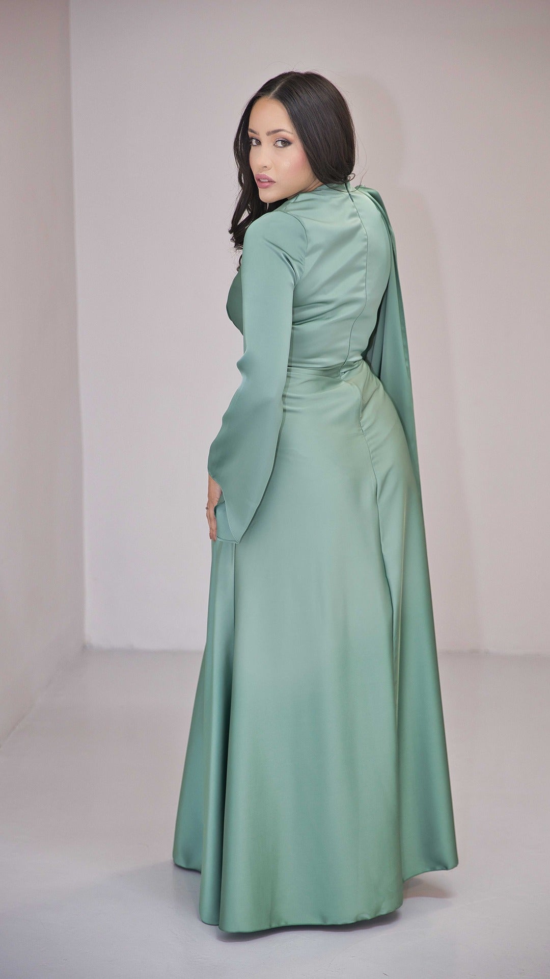 Sage Green Silk Satin Dress with Gold Embellishment and a Single Sided Cape Sleeve.