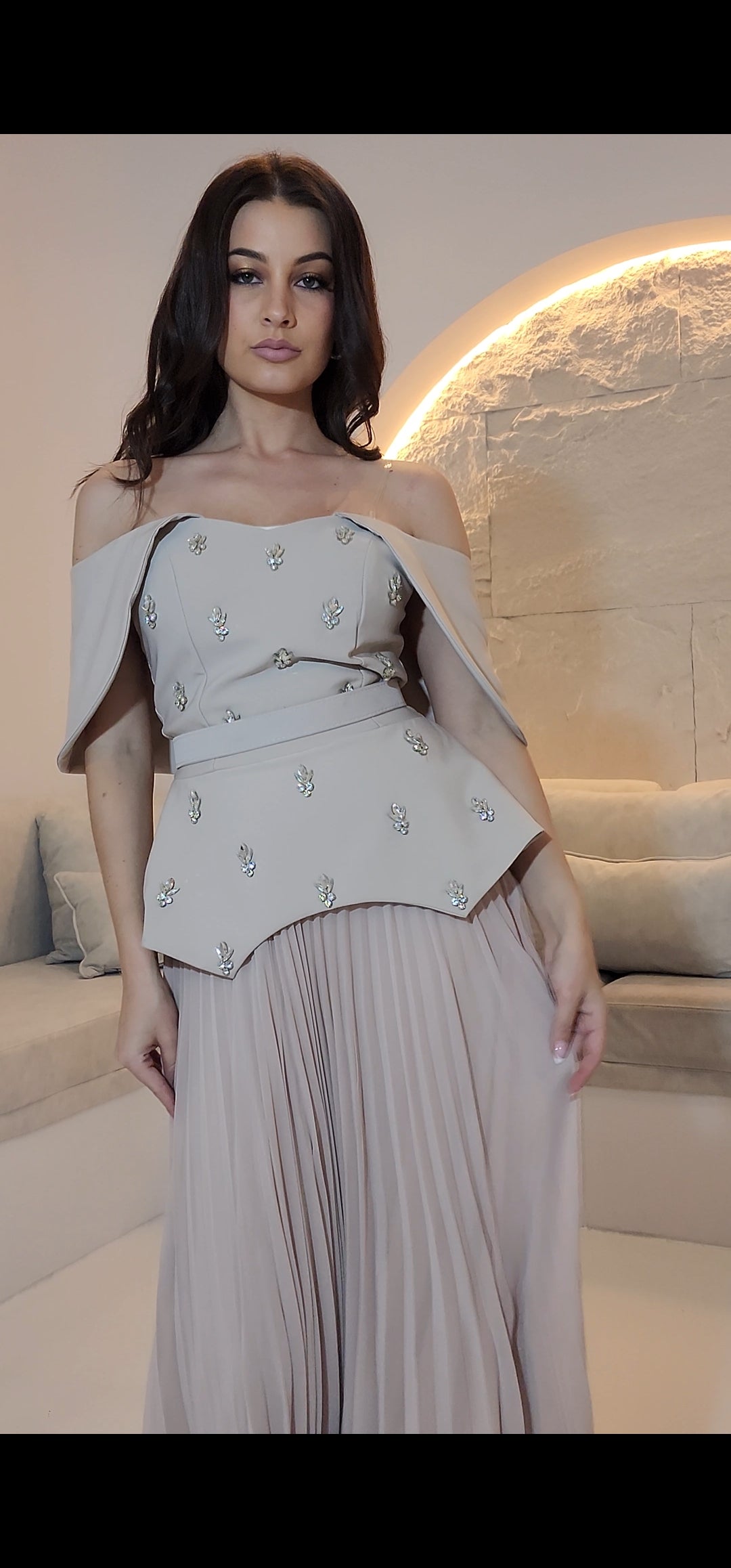 Exclusive Nude Peplum Dress with Crystal Detail.